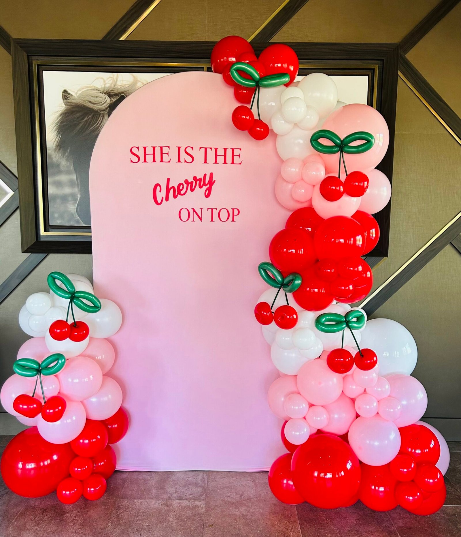 cherry red and pink balloon arches